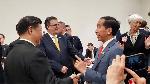 President Jokowi chats with his Chinese counterpart Xi Jinping during the G20 Summit in Osaka, Japan. Photo: Presidential Secretariat Press Bureau