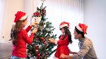 Illustration of decorating a Christmas tree. Shutterstock
