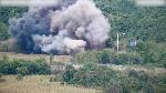 Smoke rises after North Korea blows up sections of inter-Korean roads on its side of the border between the two Koreas, according to South Korea's military, as seen from the South Korean side, October 15, 2024, in this screen grab from a handout video. South Korean Defence Ministry/Handout via REUTERS    